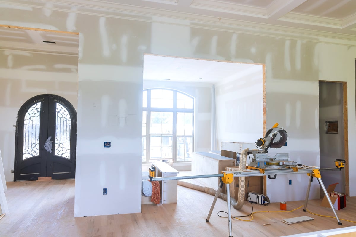 Living space during a home renovation with tools and unfinished walls